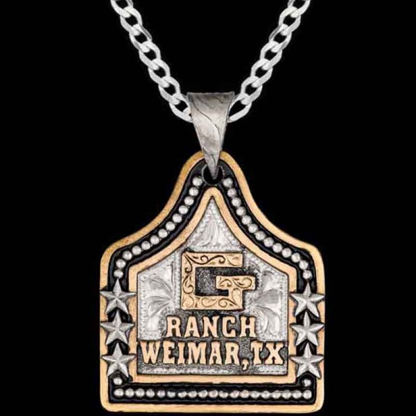 Speckles, German Silver base 1.75"x1.50" framed by a bead edge and stars. Jewelers Bronze Ranch Logo, letters, and a line edge.

Chain not included. 